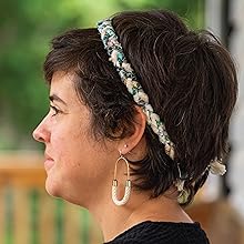 A woman wearing the Braided Headband.