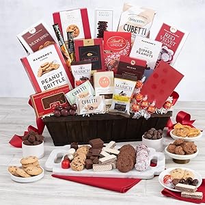 Chocolates, cookies, nuts, and fudge inside a large gift basket