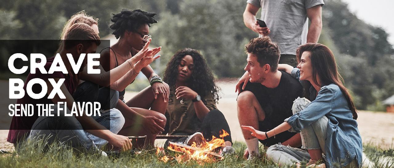 cravebox brand story image young people sitting around fire enjoying time together