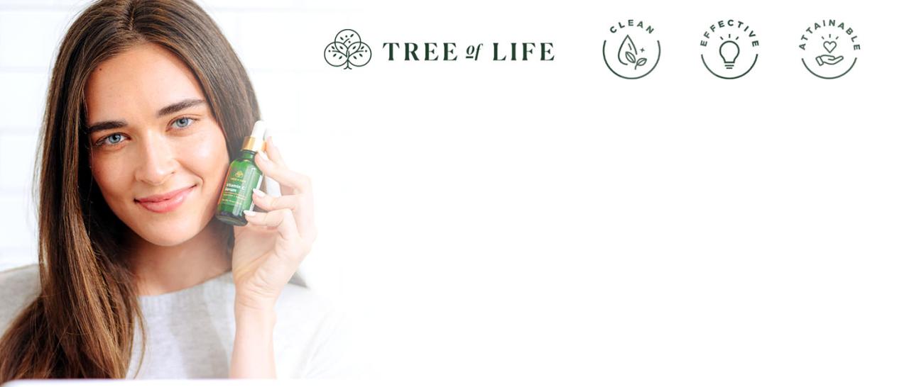 Tree of Life skincare products in a lush, greenery background