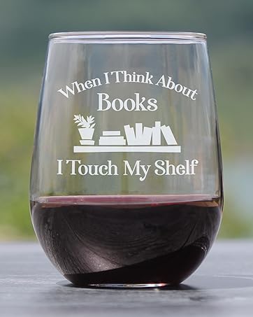 Text says when I think about books I touch my shelf, engraved onto a stemless wine glass